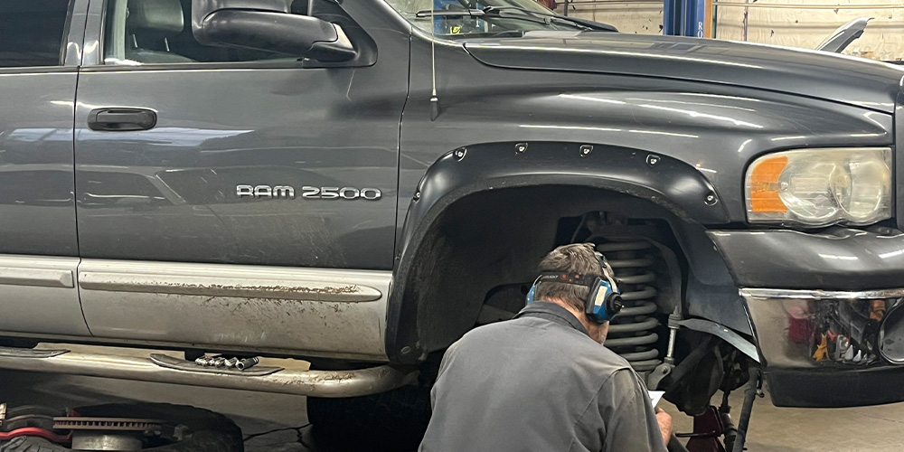 Maynards ASE repair tech servicing RAM 2500 truck